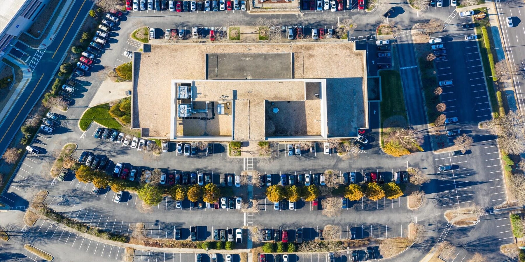 Aerial view of a commercial property maintained by Whirlwind Lot and Land Care