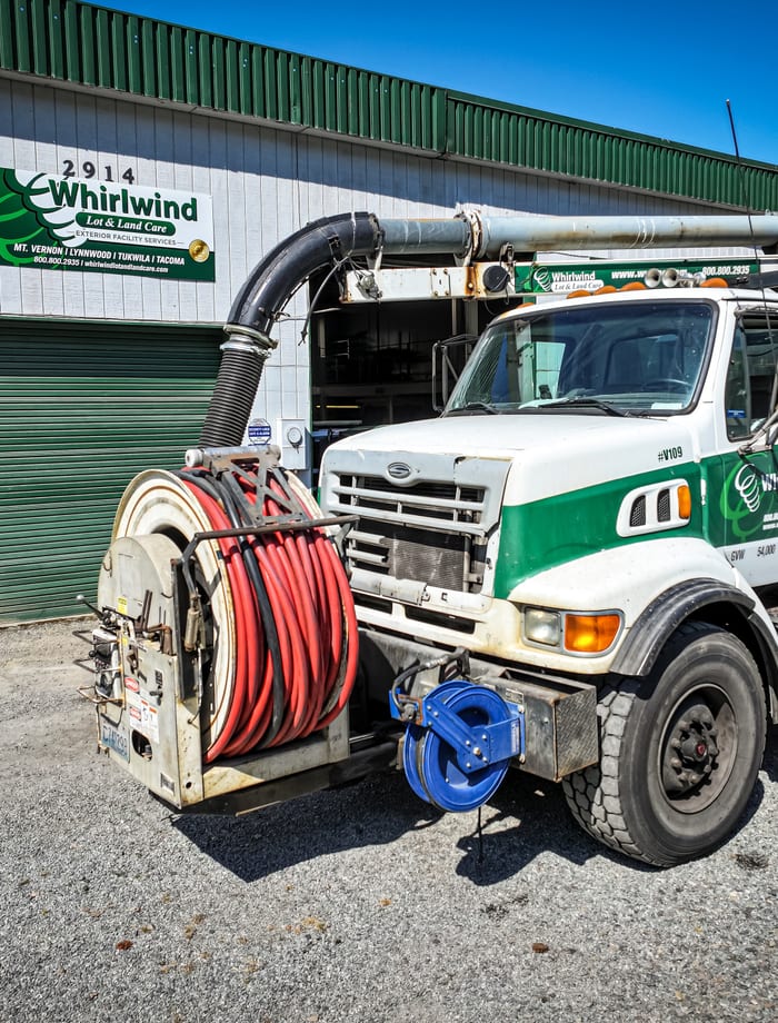 Spill response team preparing protective equipment for industrial cleanup